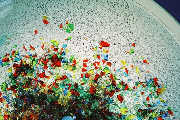 Close-up of a countertop made from recycled glass, showing embedded colorful fragments, illustrating beauty in repurposed materials.