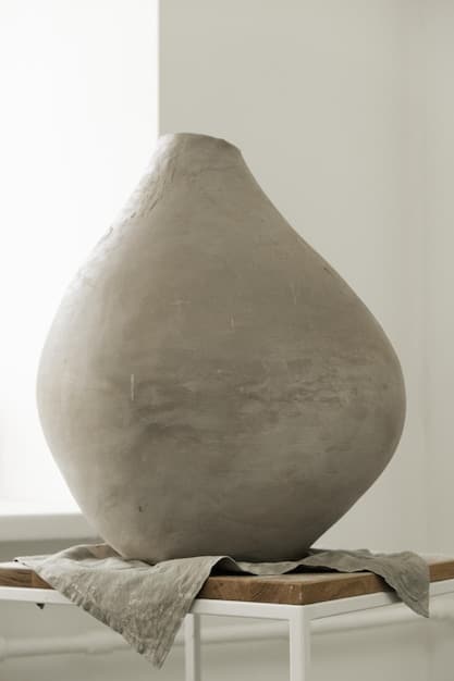 A close-up of a handcrafted ceramic vase with a subtle, earthy glaze, emphasizing artisanal quality and sustainable craftsmanship.