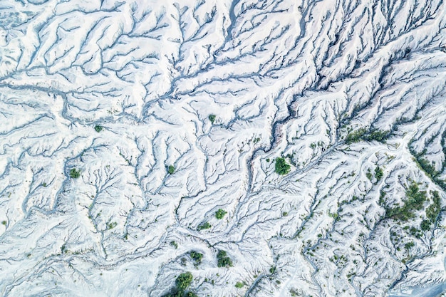 A satellite view showing diminishing snowpack on a mountain range in the Western US, with a clear line of melting snow.