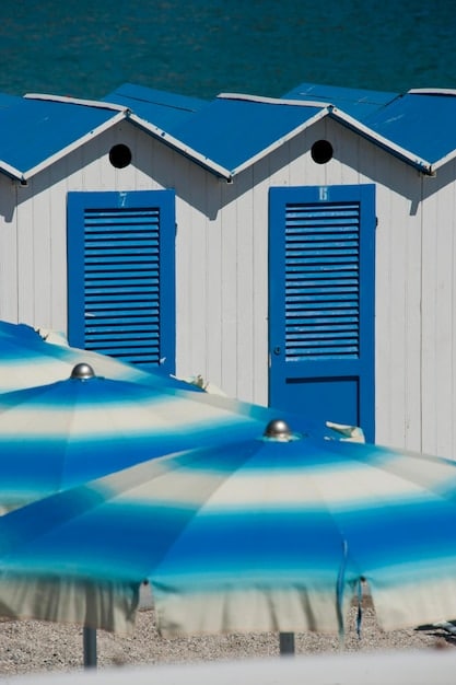 A detailed close-up of hurricane shutters being installed on a coastal home, emphasizing robust storm-proofing.