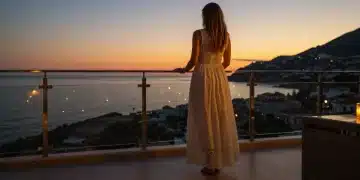 Summer Evening Wear 2025: 4 Effortless Elegance Pieces Woman in elegant flowing lace maxi dress at sunset