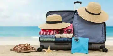 Efficiently packed suitcase for a 7-day summer vacation with essential summer items.
